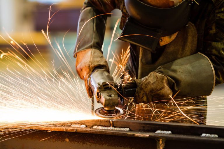 Electric wheel grinding on steel structure